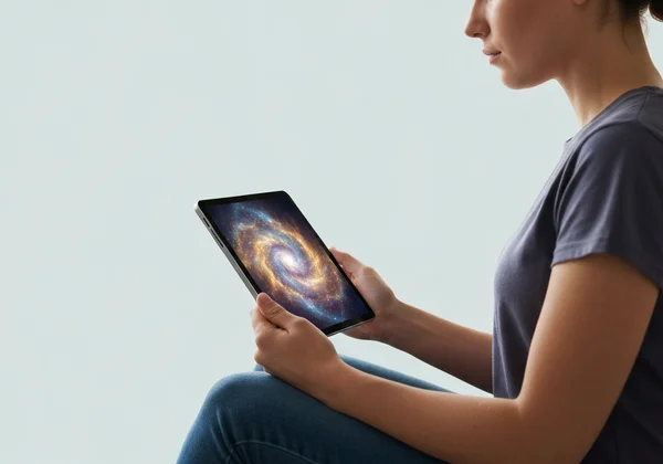 Person completing a thoughtful self-assessment form on a digital tablet